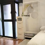 Room With Bathroom, Refrigerator And Microwave