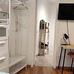Room With Bathroom, Refrigerator And Microwave