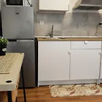 Room With Bathroom, Refrigerator And Microwave