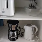 Room With Bathroom, Refrigerator And Microwave
